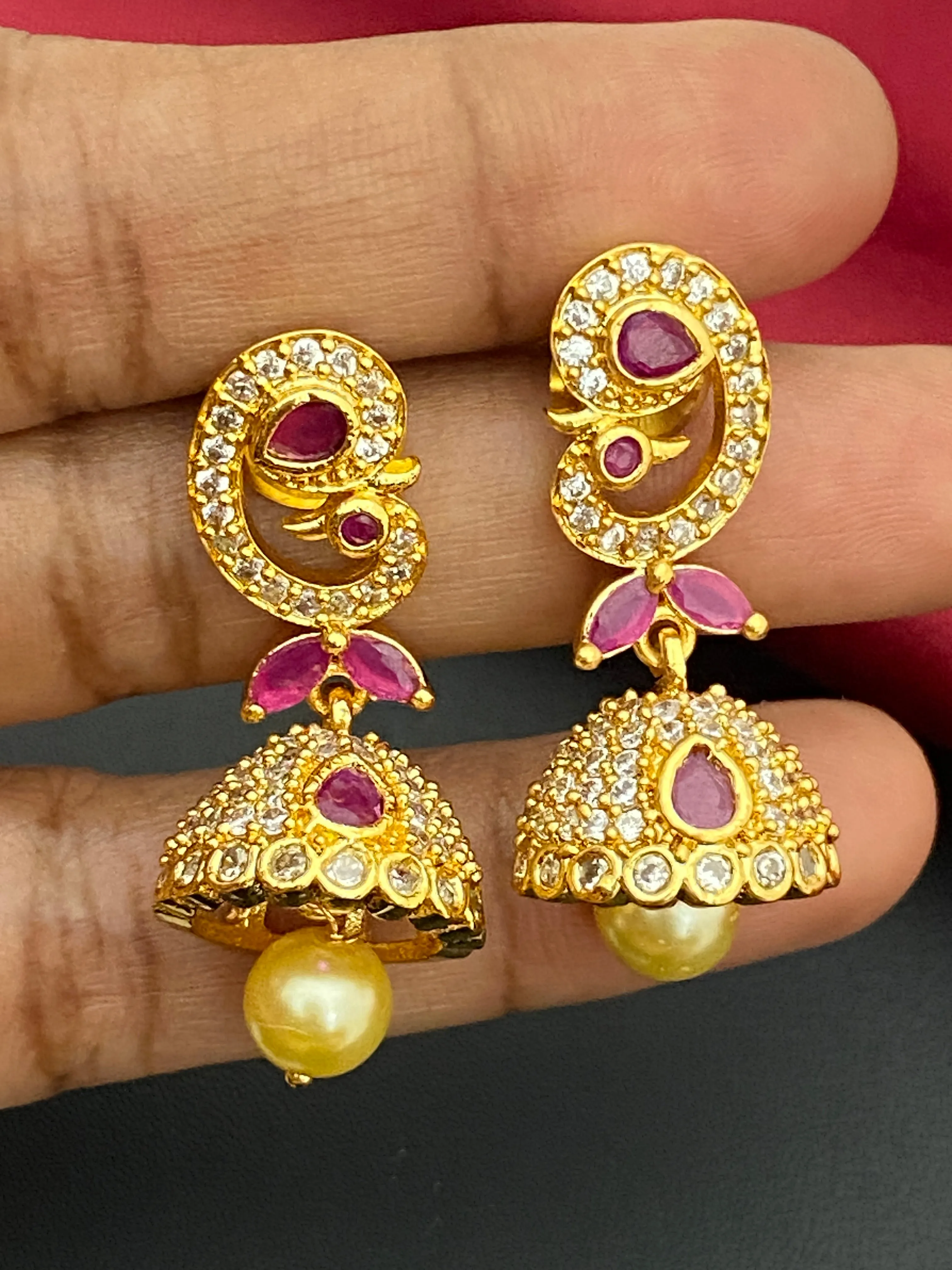 Dazzling Gold plated Ruby Stoned Jhumka Earrings